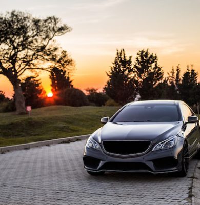 grey-luxury-sedan-car-sunset_114579-4045