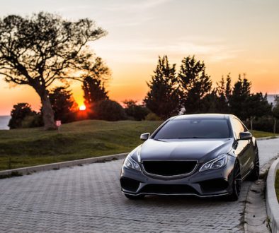 grey-luxury-sedan-car-sunset_114579-4045